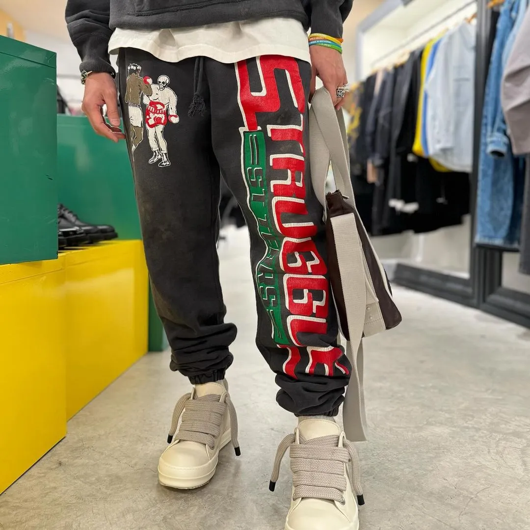 SAINT Mxxxxxx x DENIM TEARS STRUGGLE SWTPNTS/BLK DT co-branded boxing retro distressed sweatpants, washed black S-XL Assute dyeing, whole piece sprayed with horse fade, authentic grade crack printing, mold customization co-branded main mark/washed mark, factory four-needle six-thread workmanship, no bone seams, more comfortable to wear